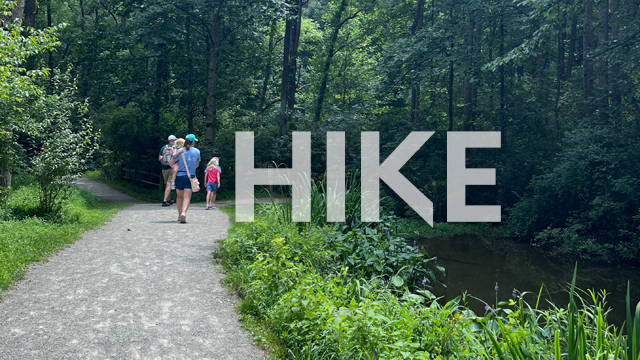 family on hiking path with the word hike